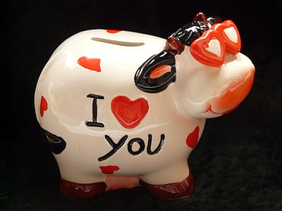 white and red cow figurine thumbnail