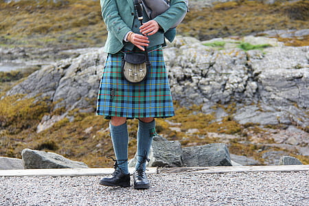 person carrying bag pipe thumbnail