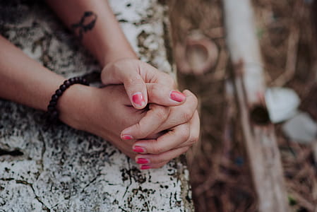 Depth of Field Photography of Human Hands on White Surface thumbnail