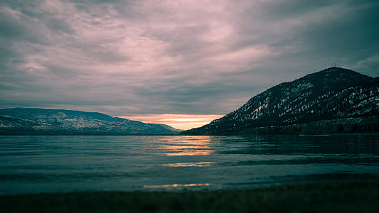 body of water near mountain thumbnail