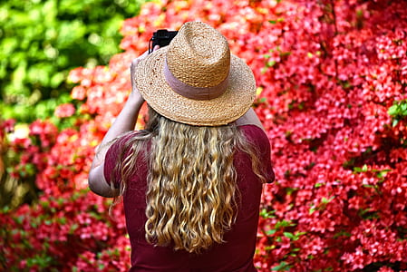 woman wearing red top and brown fedora hat thumbnail