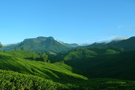 green mountains under blue sky thumbnail