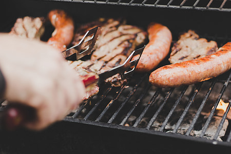 Hungarian Sausage and pork on charcoal grill thumbnail