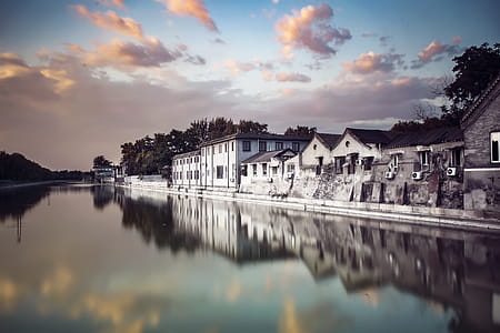 White and Brown Houses Beside Body of Water thumbnail