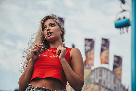Young Woman Holding Sunglasses Photo thumbnail