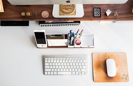 Apple wireless keyboard and Apple Magic Mouse on desk thumbnail
