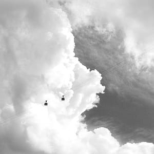 grayscale photography of two cable cars thumbnail