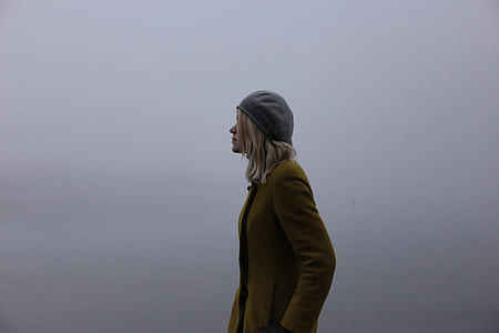 blonde haired woman in brown coat and gray beanie thumbnail