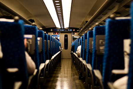 selective focus photography of train chairs thumbnail