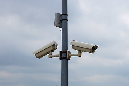 two white bullet type security cameras thumbnail