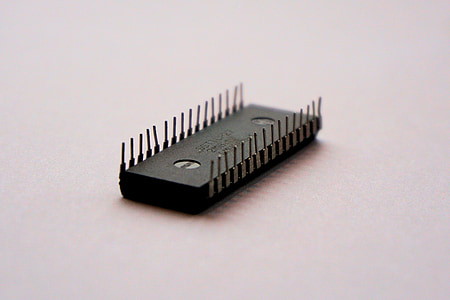 32-pin IC lying on white surface thumbnail