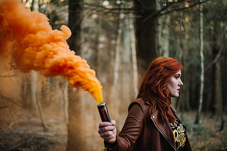 photo of woman holding black flare thumbnail