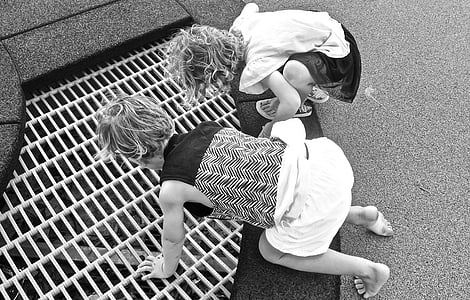 grayscale photo of two child thumbnail