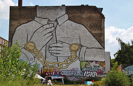 graffiti on wall near tree thumbnail