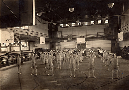 grayscale photo of people standing on basketball court thumbnail