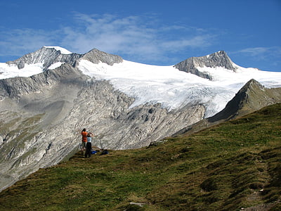landscape photo of two person standing on mountain thumbnail