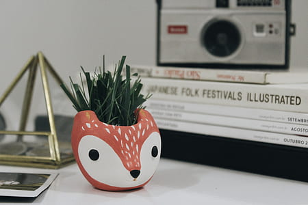 photo of white and orange deer vase thumbnail