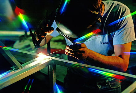 man in gray T-shirting weld steel thumbnail