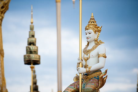 gold and brown Hindu statue during daytime thumbnail
