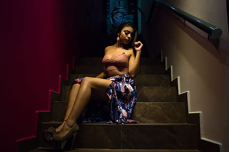 woman wearing gown sits on stair thumbnail