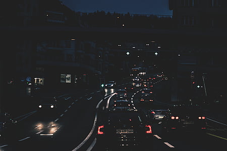vehicles travelling on road during nighttime thumbnail