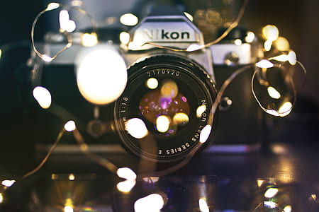 black Nikon DSLR camera thumbnail