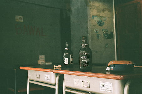 two San Miguel beer pilsen on wooden desks thumbnail