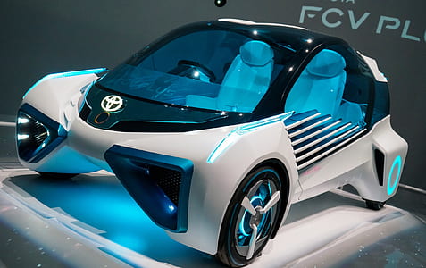white and blue Toyota smart car thumbnail