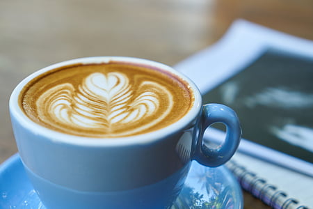 coffee with cream in a white cup thumbnail