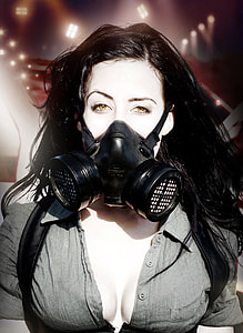 portrait photograph of woman wearing gas mask thumbnail