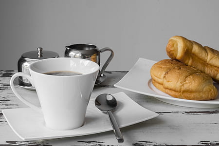 white ceramic coffee mug filled with coffee thumbnail