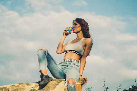woman drinking in blue can thumbnail