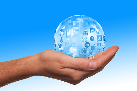 clear globe with websites on person's right palm thumbnail