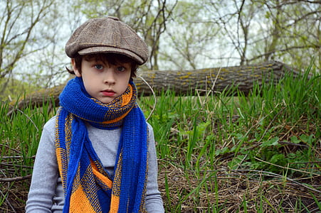 toddler standing near green grass thumbnail