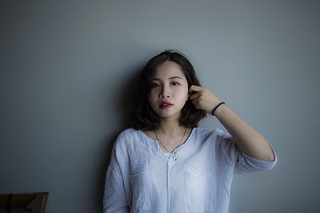 Woman Wearing Blue Long-sleeved Shirt thumbnail