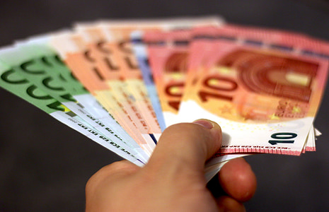 person holding banknote lot thumbnail
