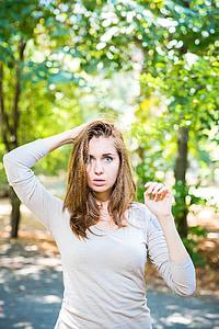 woman putting her right hand on her head thumbnail