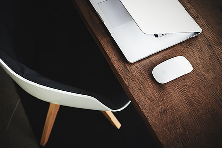 white Apple Magic mouse on table thumbnail