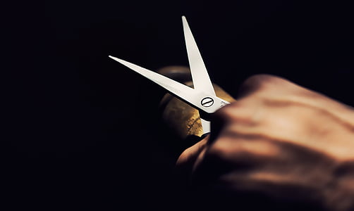person holding scissor thumbnail