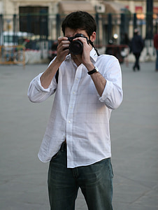 man taking photo standing thumbnail