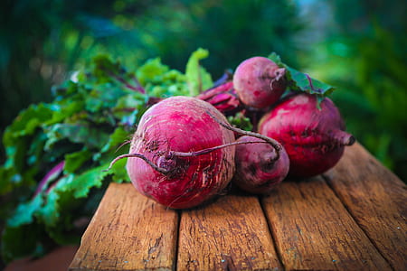 red beet on brown wooden surface thumbnail