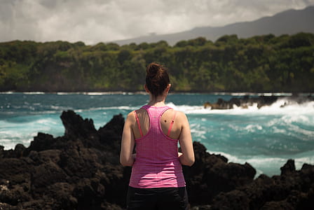 woman in front of body of wter thumbnail