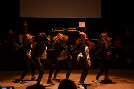 group of women performing on stage thumbnail