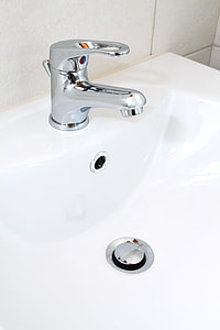 close up photo of white ceramic sink with stainless steel faucet thumbnail