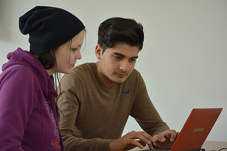 man and woman facing laptop thumbnail