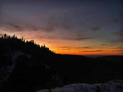 silhouette of mountain during golden hour thumbnail