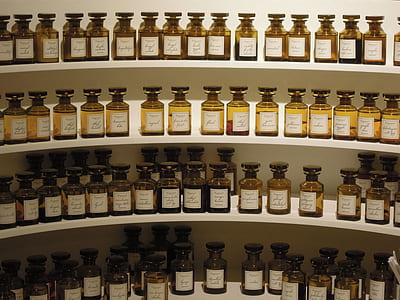 brown glass bottle lot on white shelf thumbnail