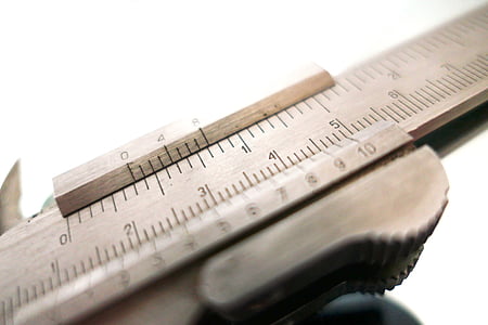 brown ruler on white surface thumbnail