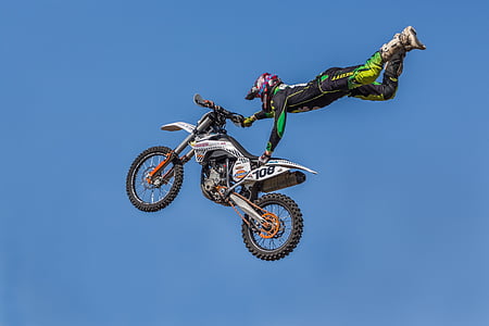 man holding white dirt bike thumbnail