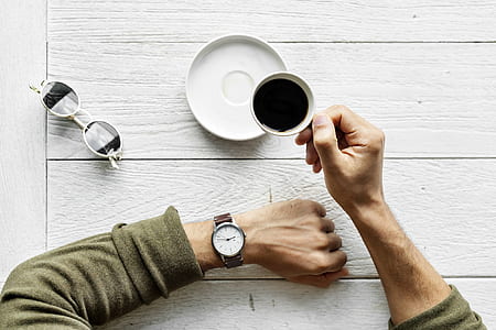 person holding cup of tea thumbnail